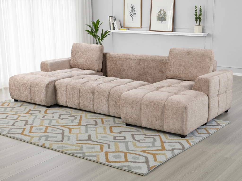 Beige sectional sofa in a living room setting with a patterned rug and decor.