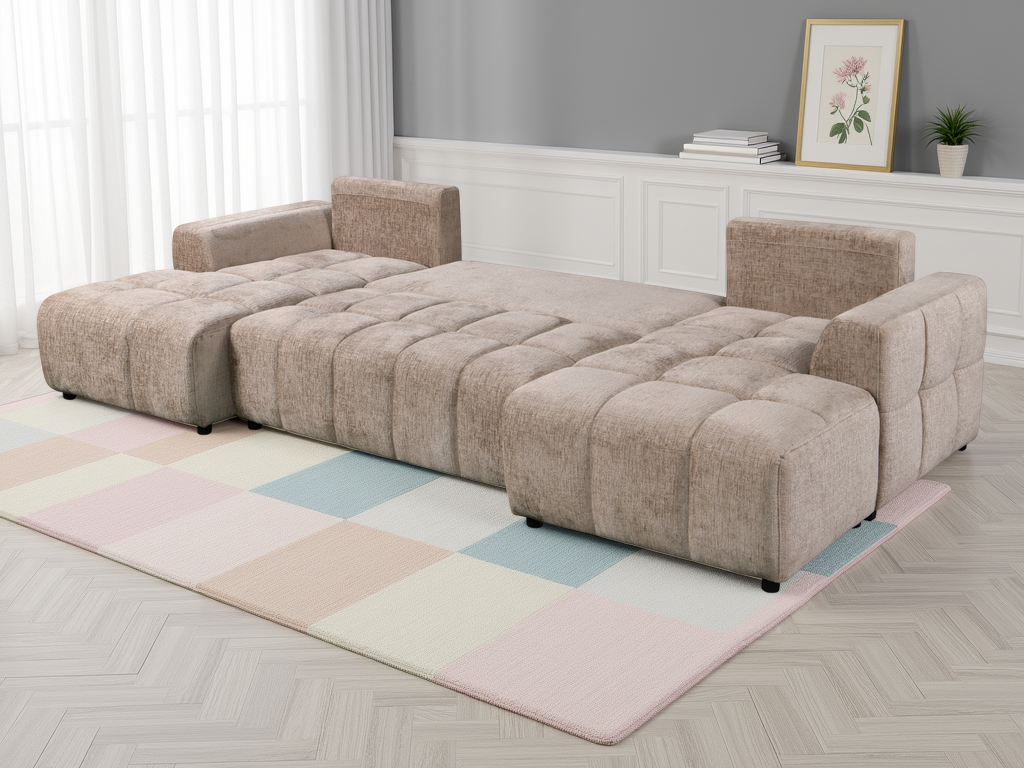 Beige sectional sofa in a living room setting with a checkered rug and framed picture on the wall.