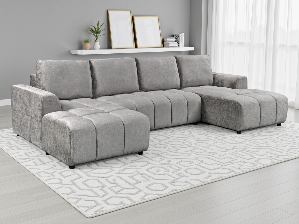 Gray sectional sofa in a living room setting with a rug and decor items.
