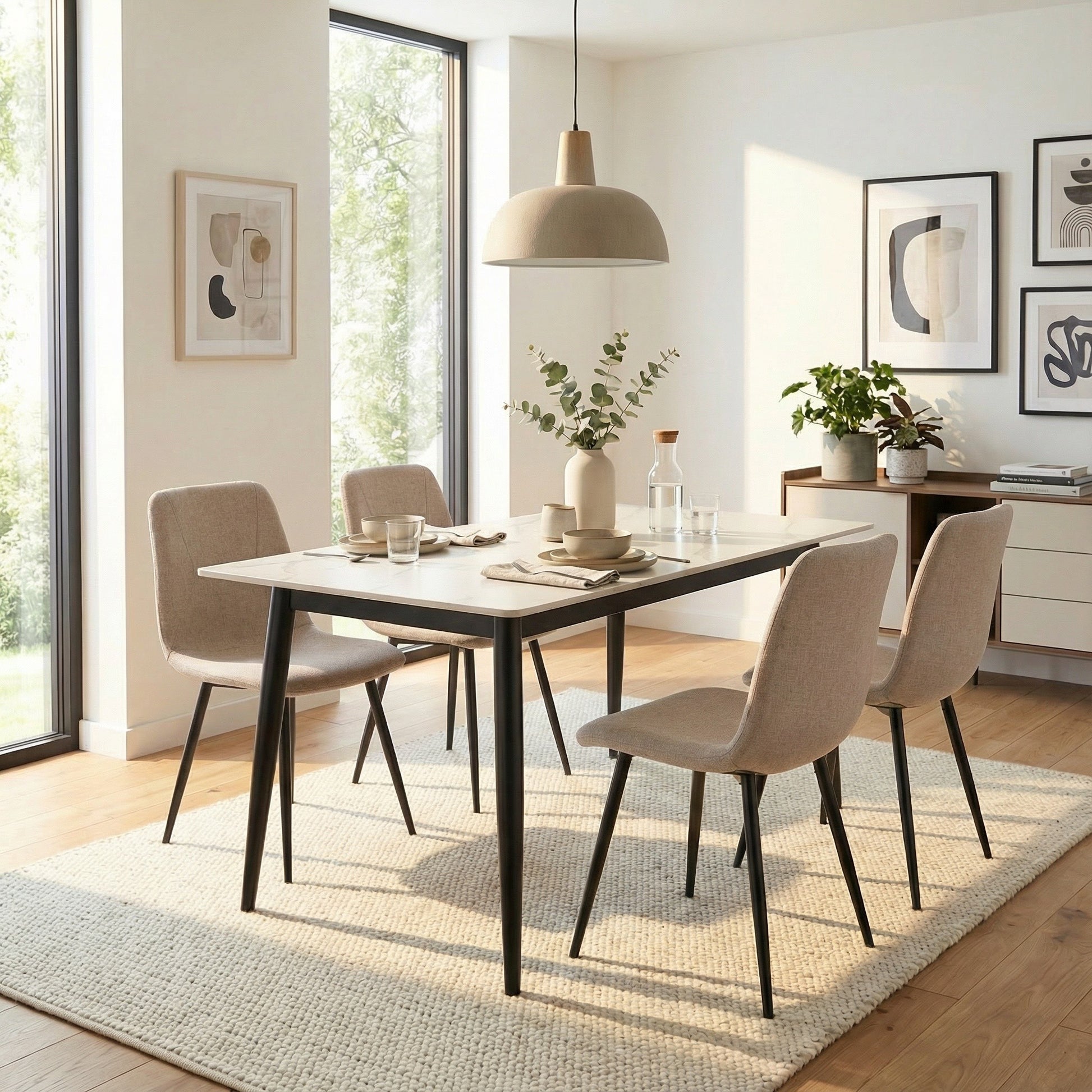 Modern dining room with a table and chairs in a well-lit room.