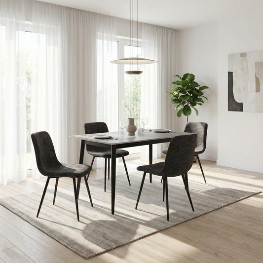 Modern dining room with a table and chairs in a well-lit room.