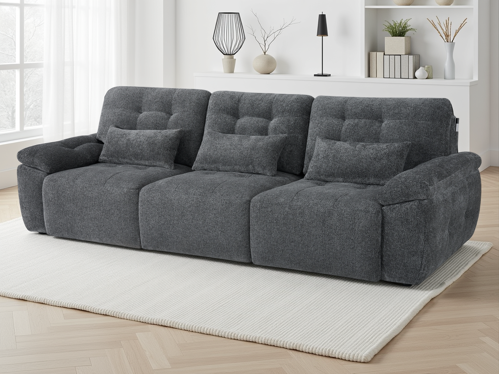 Gray sofa in a living room setting with decor elements.