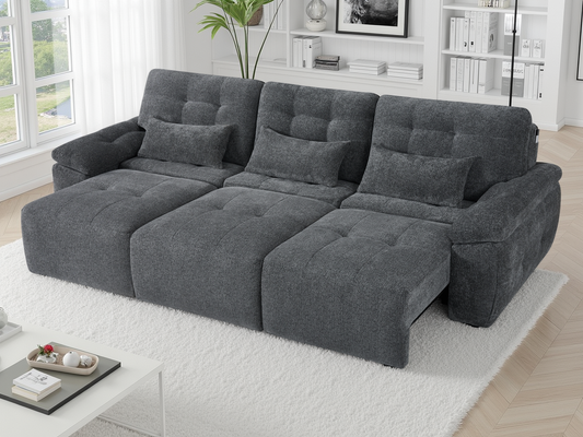 Gray sectional sofa in a living room setting with decor elements.