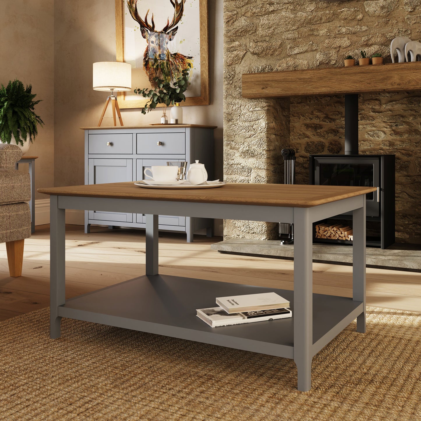 Wooden dining table with a gray base in a cozy living room setting.
