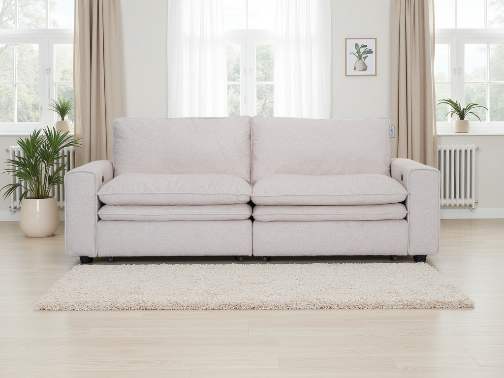 Light gray sofa in a bright living room with large windows and plants.