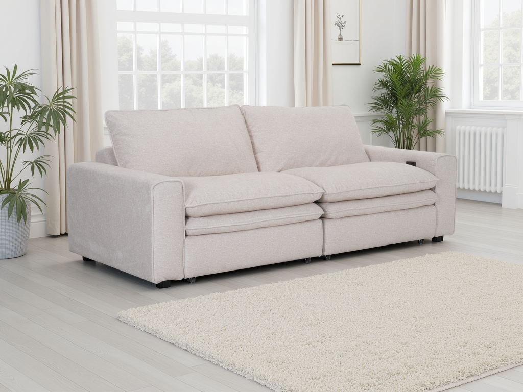 Light gray sofa in a living room with plants and curtains