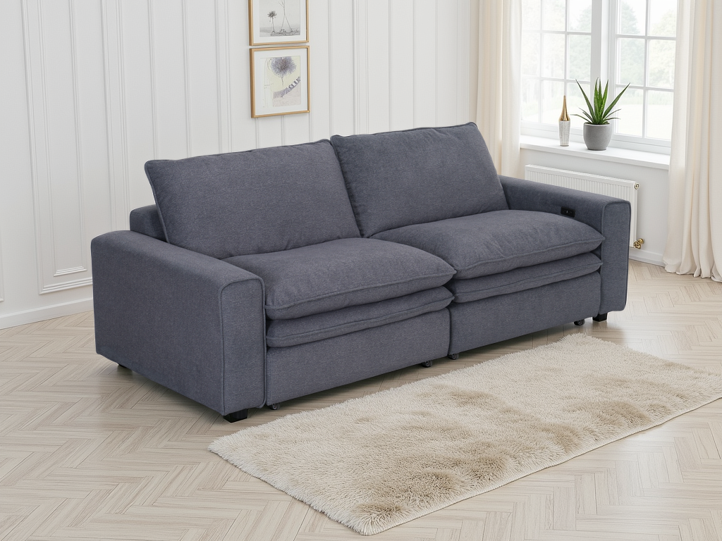 Gray sofa in a room with a window and light-colored floor.