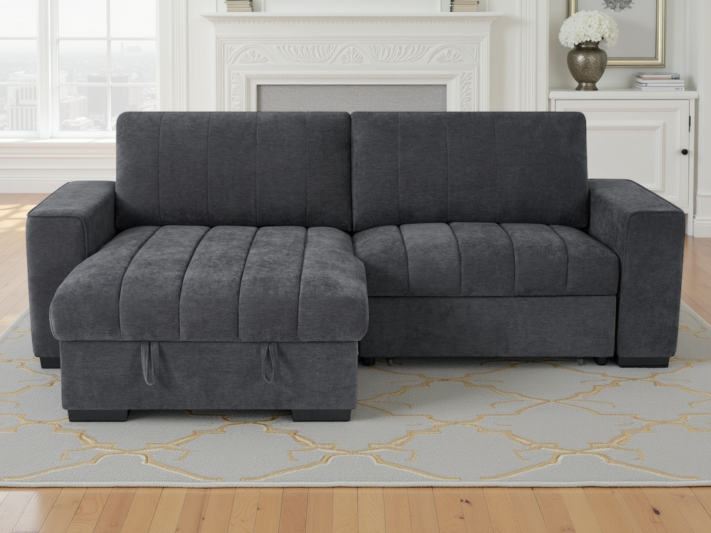 Gray sectional sofa in a living room setting with a fireplace and rug.