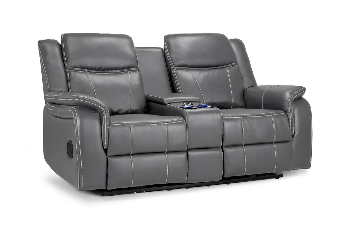 Gray leather reclining sofa with cup holders on a white background
