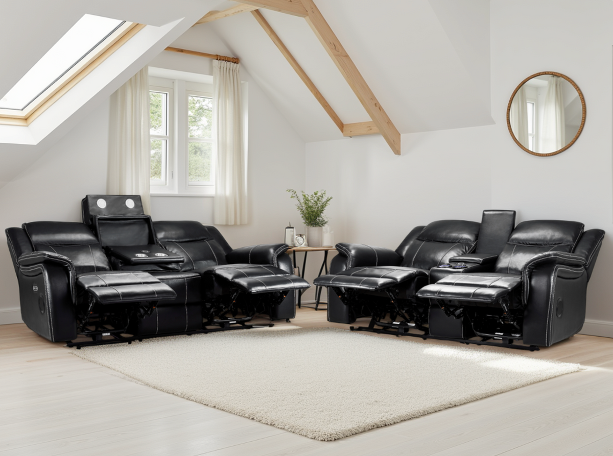 Black leather recliner sofa set in a modern living room with white walls and wooden beams.