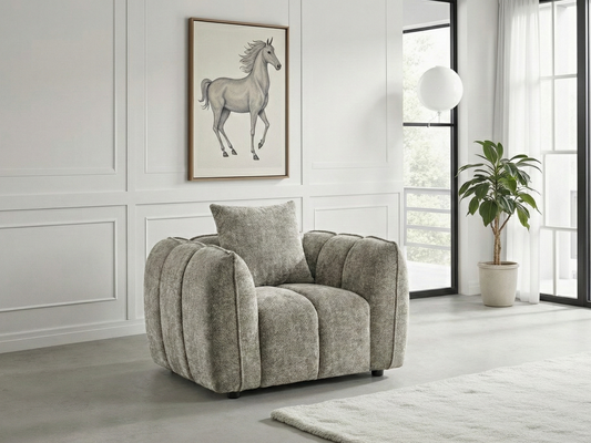 Gray armchair in a modern living room with a horse painting on the wall.