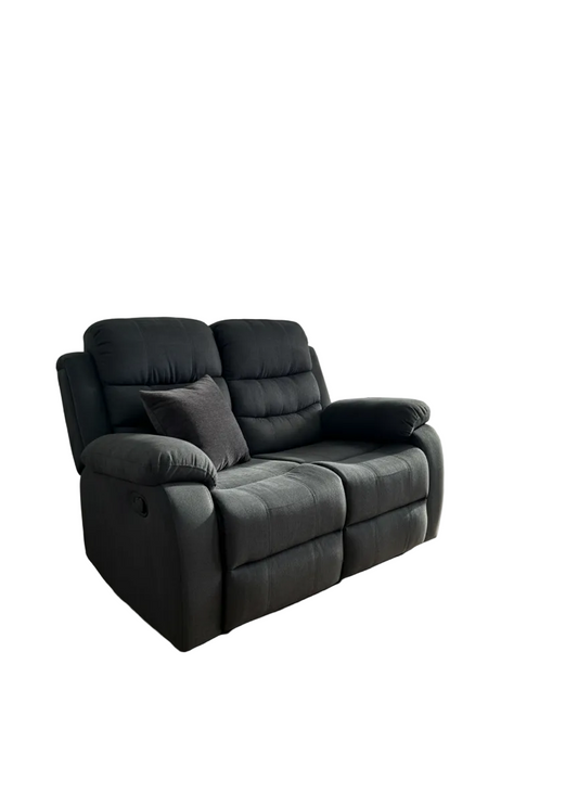 A black two-seater reclining loveseat sofa with a matching throw pillow, shown on a plain white background.