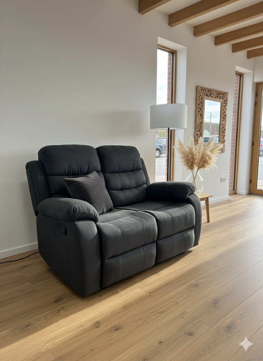 Black sofa in a room with wooden floor and large windows