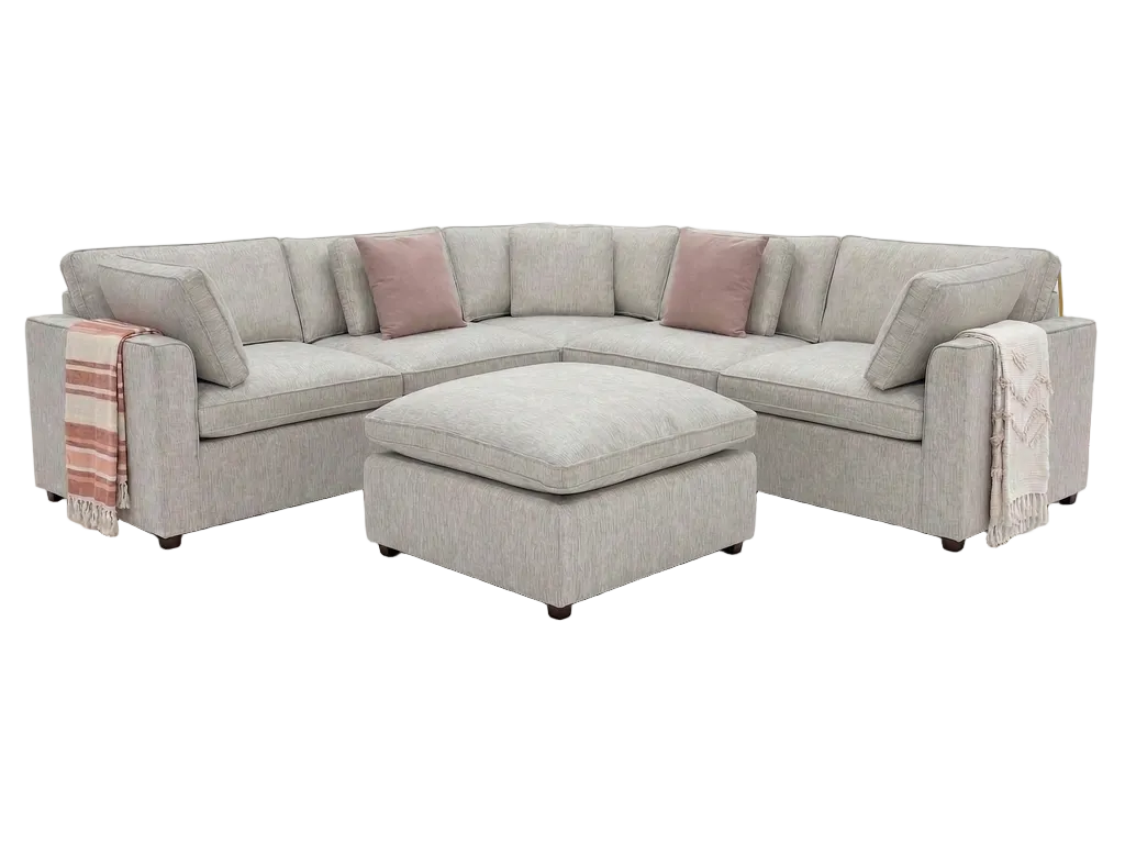 A light gray upholstered sectional sofa with an ottoman on a solid white background.