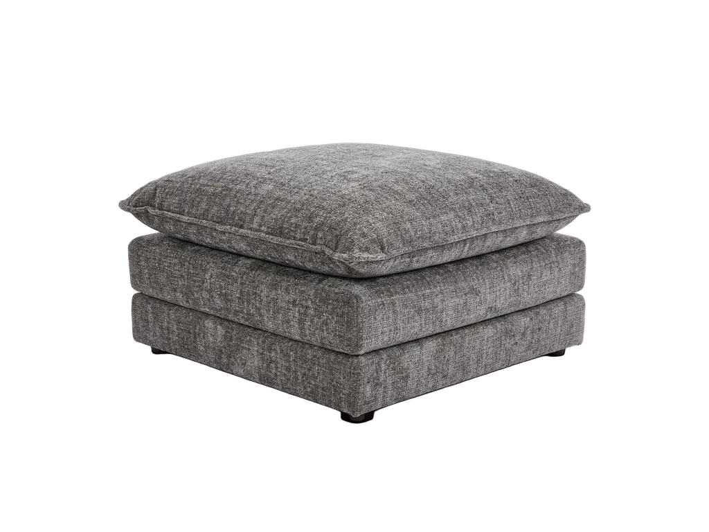 A square ottoman upholstered in textured gray fabric, featuring a thick matching gray throw pillow resting on top, shown against a plain white background.