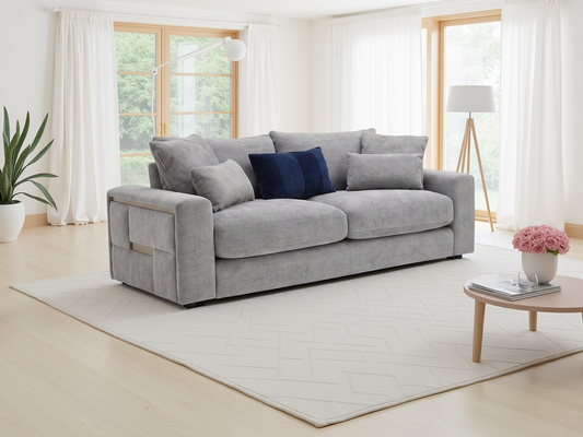 Gray sofa in a living room with a coffee table and decorative items.