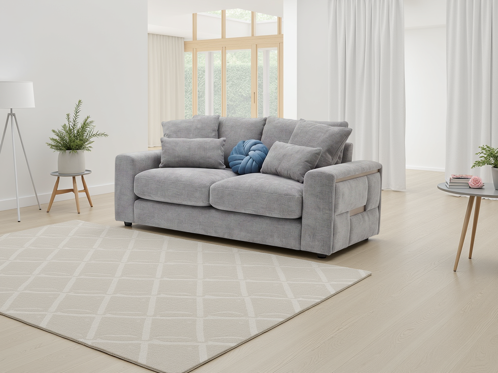 Gray sofa in a modern living room with a rug and decorative items.