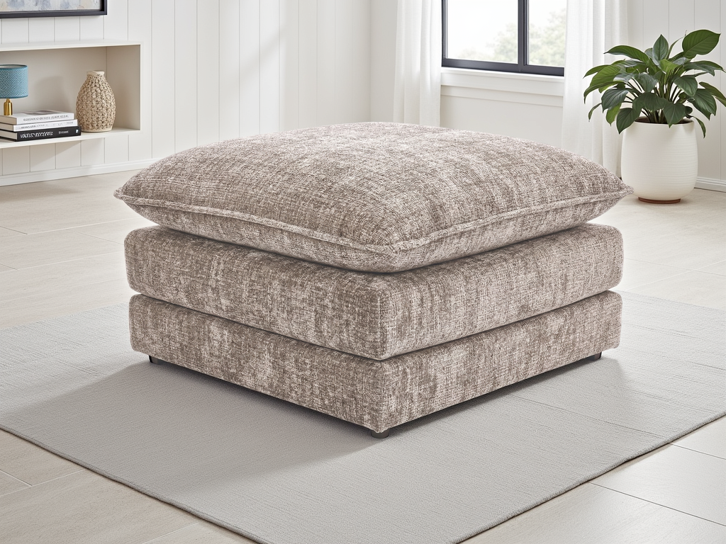 Textured ottoman in a room with a plant and shelves.