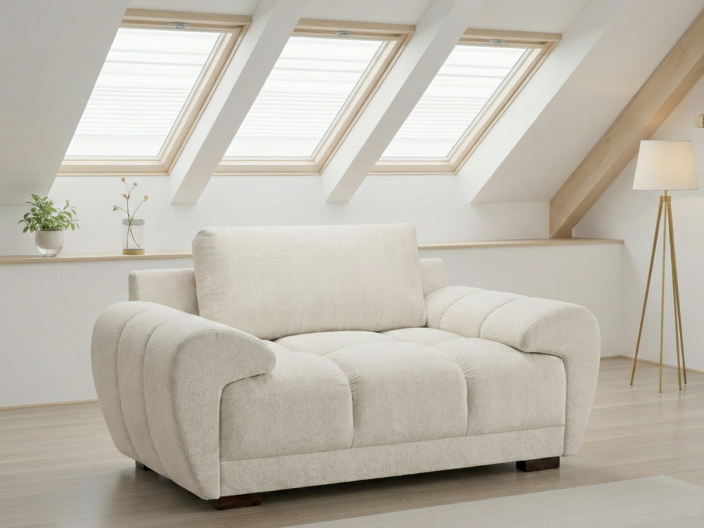 Beige sofa in a room with skylights and a lamp.