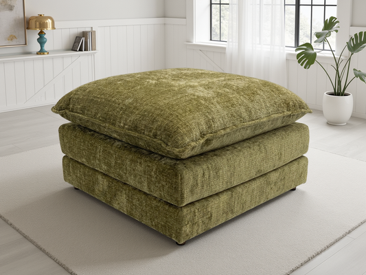 Green textured ottoman in a room with a window and plant