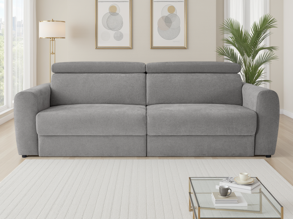 Gray sofa in a living room with a coffee table and decor items.