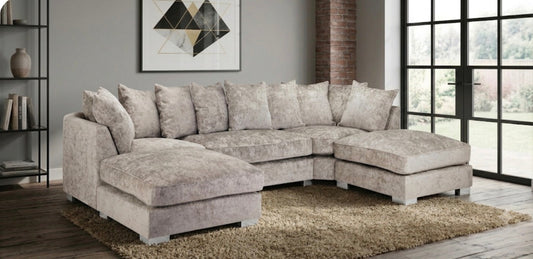 A light beige textured fabric sectional sofa with a left-facing chaise and a right-facing chaise, styled in a modern living room.