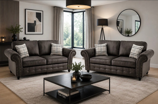 A staged living room showing a dark brown tufted loveseat 3+2 seater sofas.