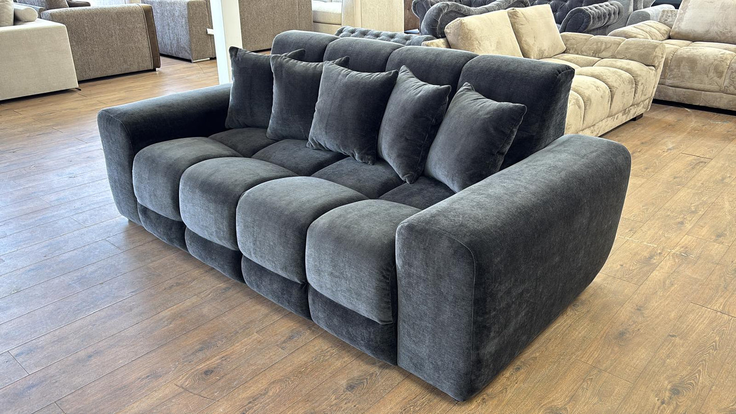 black sectional sofa in a showroom setting 