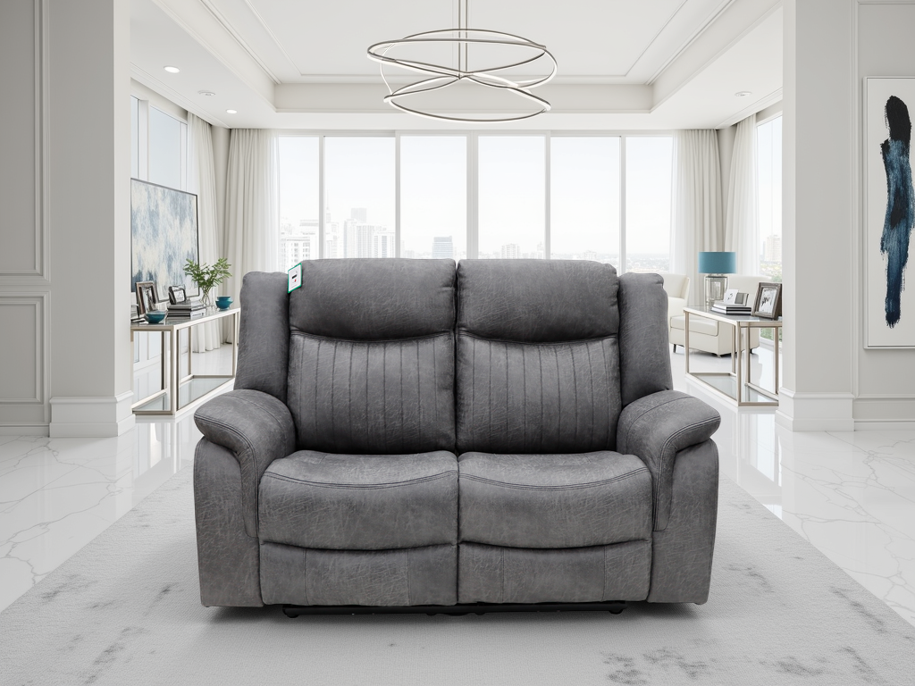 Gray sofa in a modern living room with large windows and minimal decor.