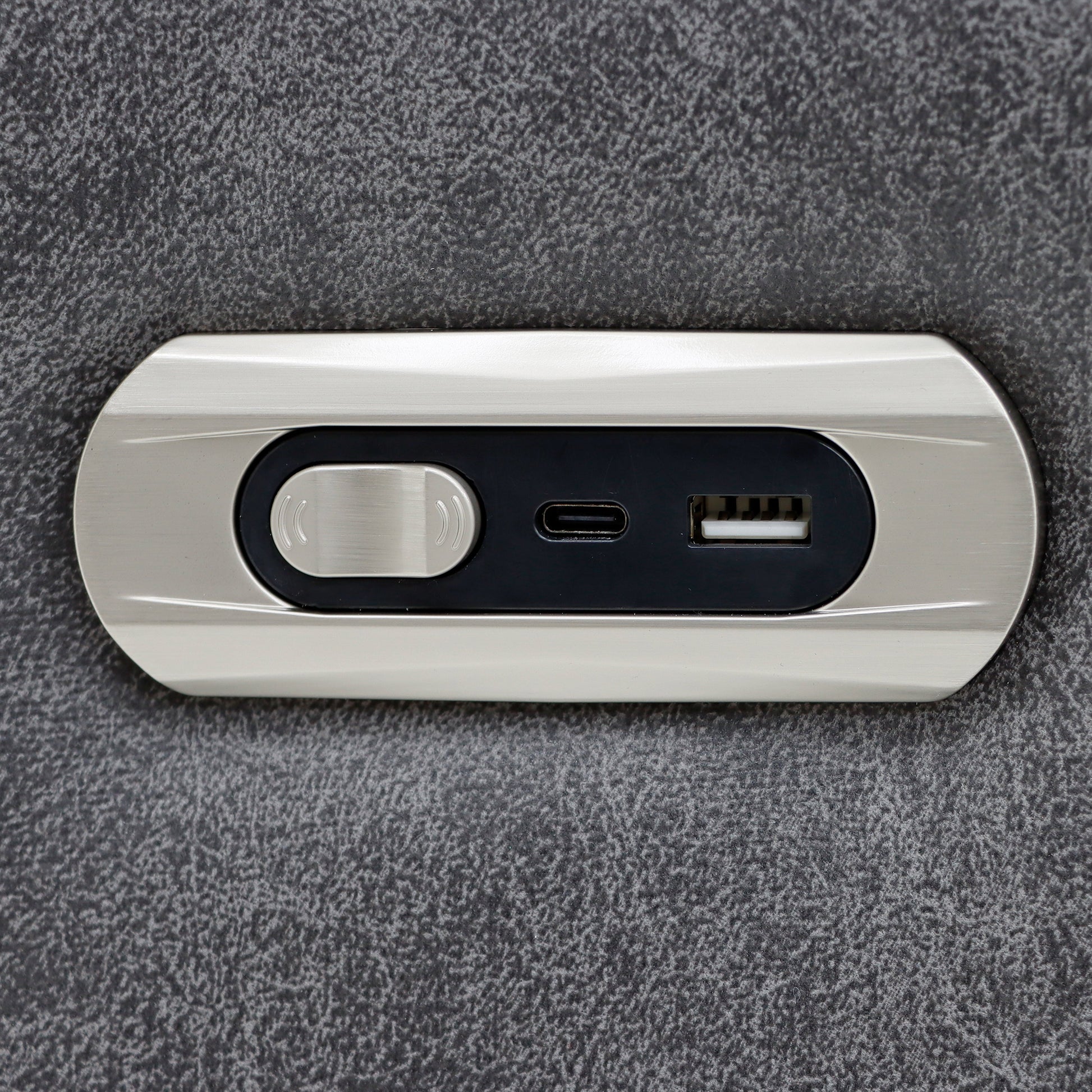 White electronic device with USB port and switch on a gray textured background