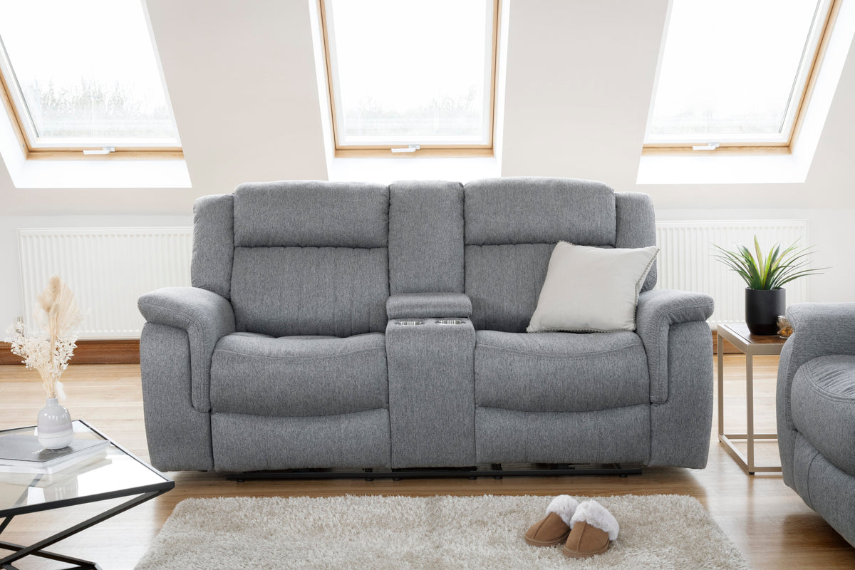 Gray sofa in a living room with large windows