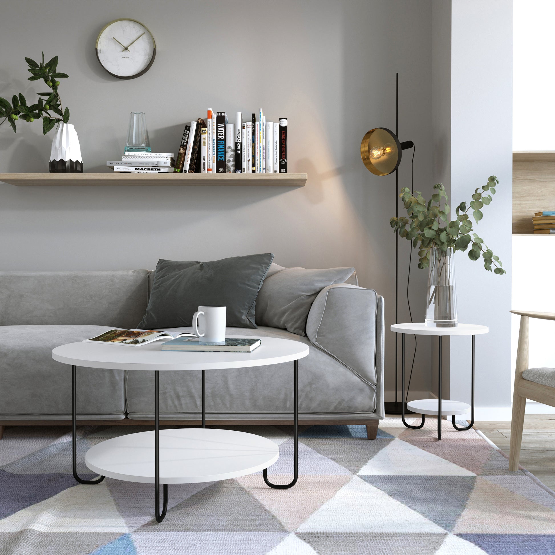 Modern living room with gray sofa, coffee table, and decorative elements.