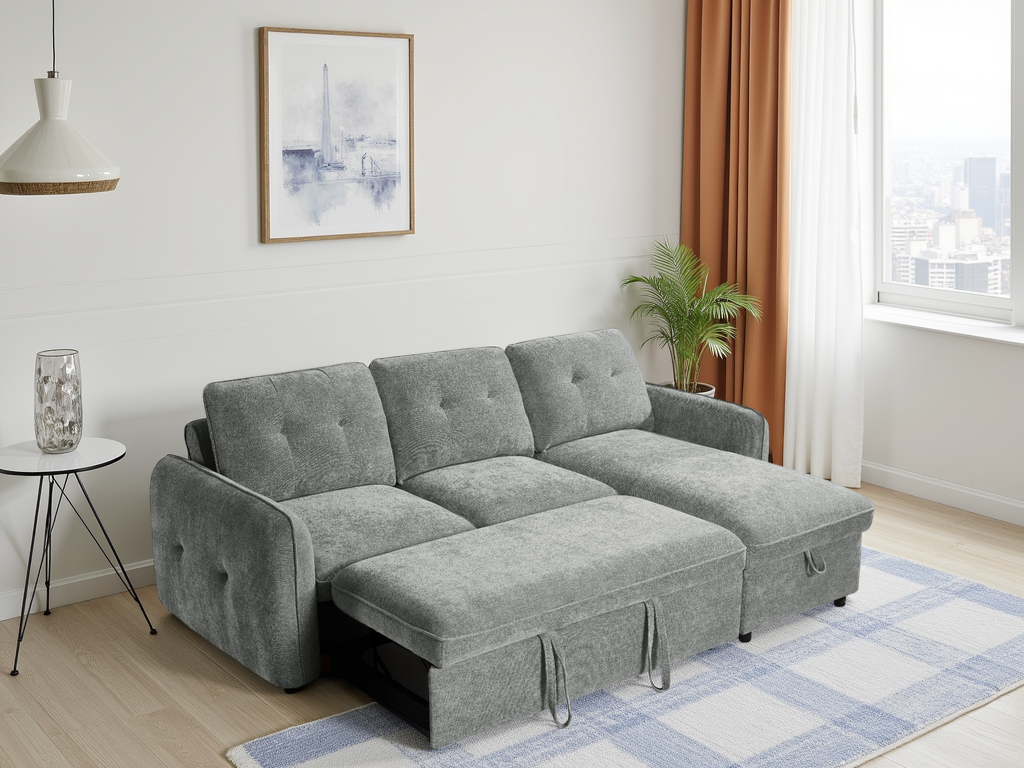 Gray sectional sofa in a living room with a small table, plant, and artwork.