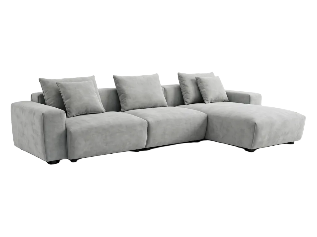 Gray sectional sofa in a living room with large windows and a white rug.