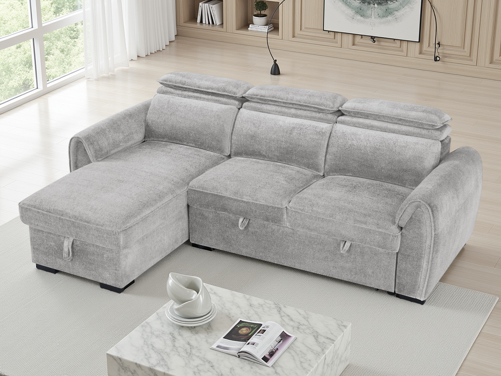A light gray fabric sectional sofa with a chaise lounge on the left, shown in a bright, modern living room.