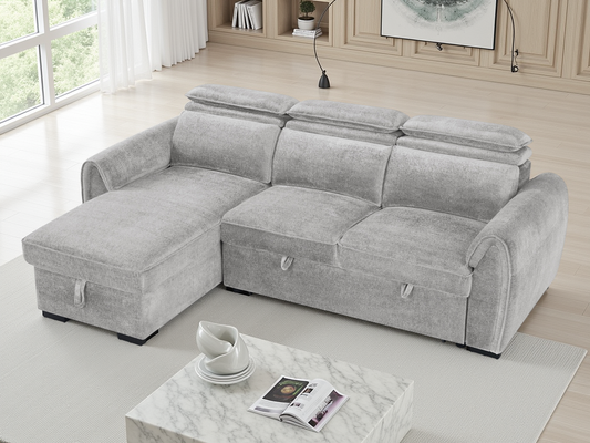 A light gray fabric sectional sofa with a chaise lounge on the left, shown in a bright, modern living room.