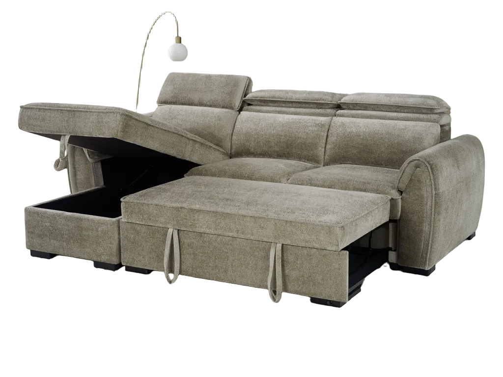 A light taupe upholstered sectional sofa with a chaise lounge and lift-up storage ottoman section, shown on a plain white background with a floor lamp behind it.
