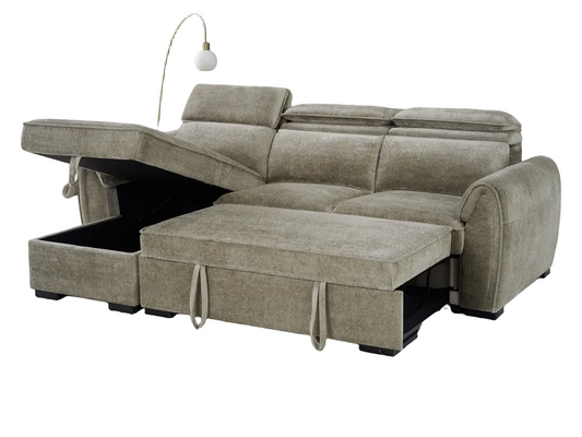 A light taupe upholstered sectional sofa with a chaise lounge and lift-up storage ottoman section, shown on a plain white background with a floor lamp behind it.