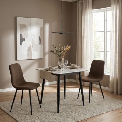 Dining room with a marble table and brown chairs, featuring a abstract painting on the wall.