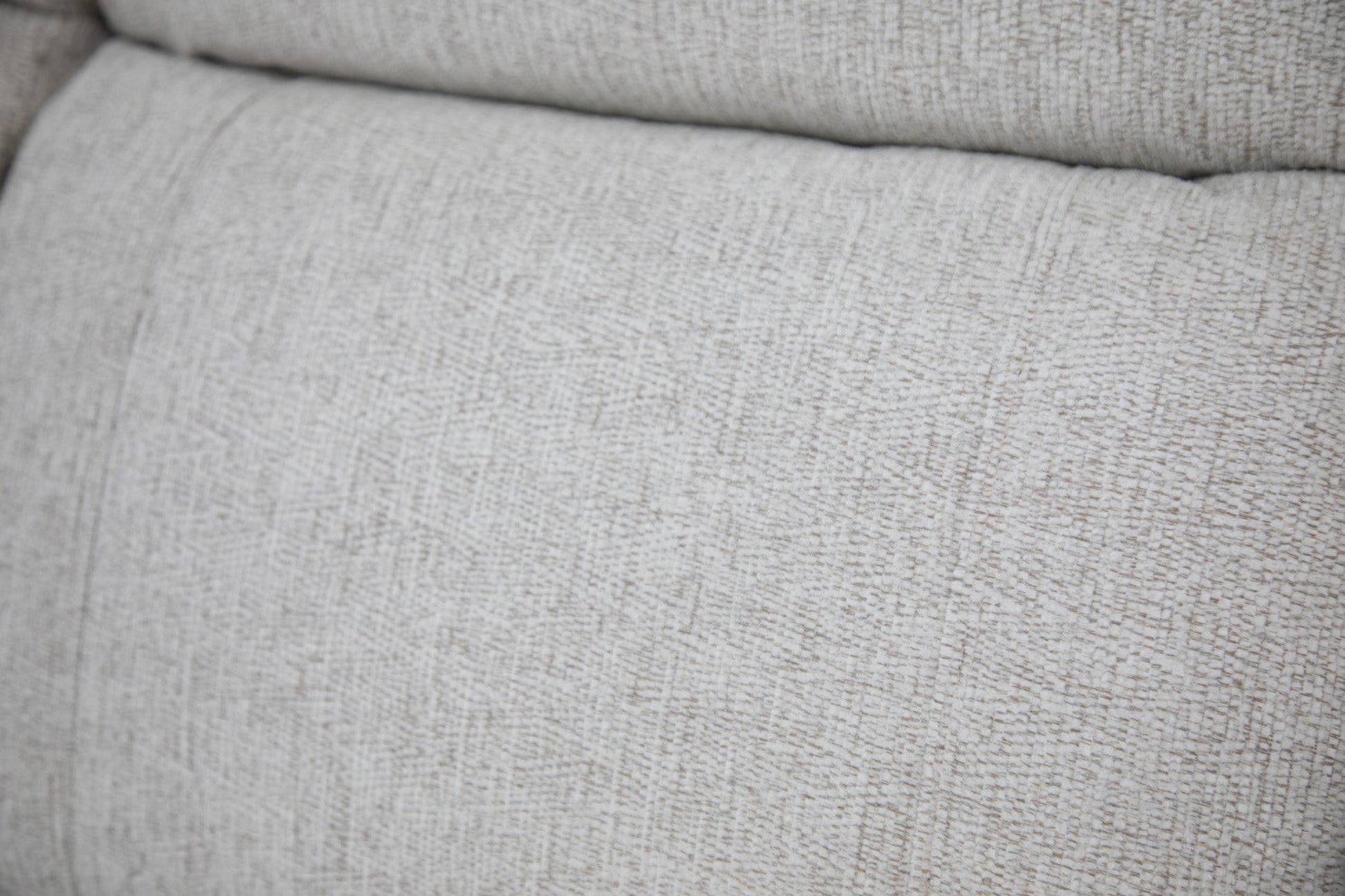 Close-up of a textured beige fabric surface