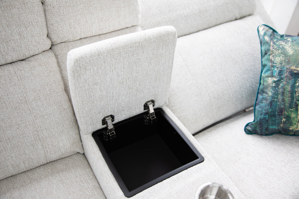 Beige sofa with a built-in storage compartment and a decorative pillow.