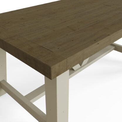 1.6m A rustic wooden table with a thick, weathered brown tabletop and a painted white frame, shown in a close-up angle against a white background.