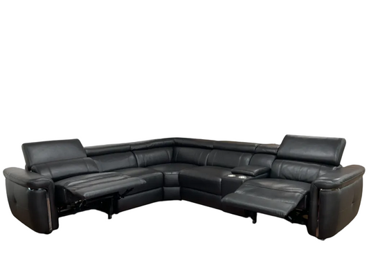 Black leather sectional reclining sofa on a white back round