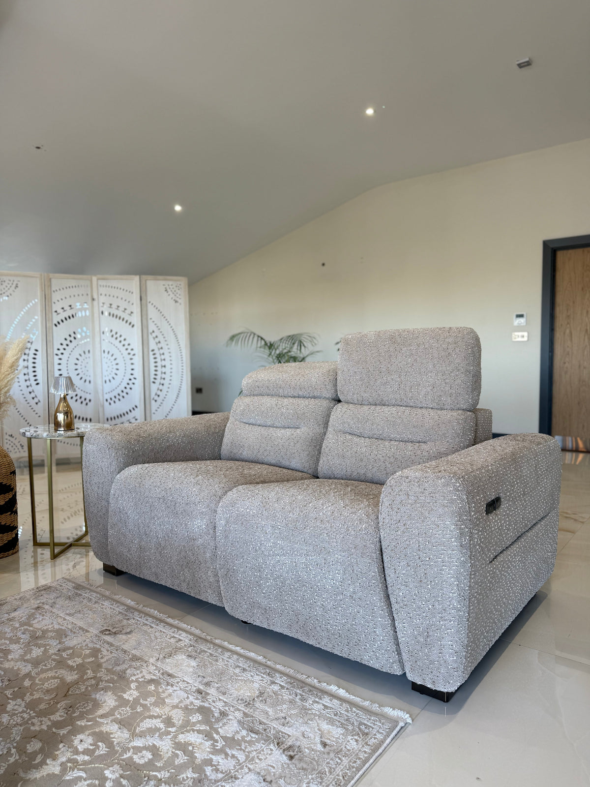 Beige sofa in a living room with decorative elements.