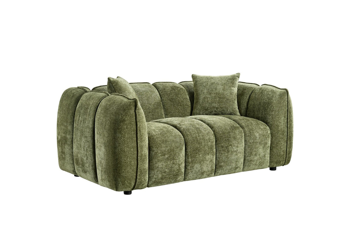 Green sofa with cushions on a white background