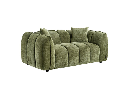 Green sofa with cushions on a white background