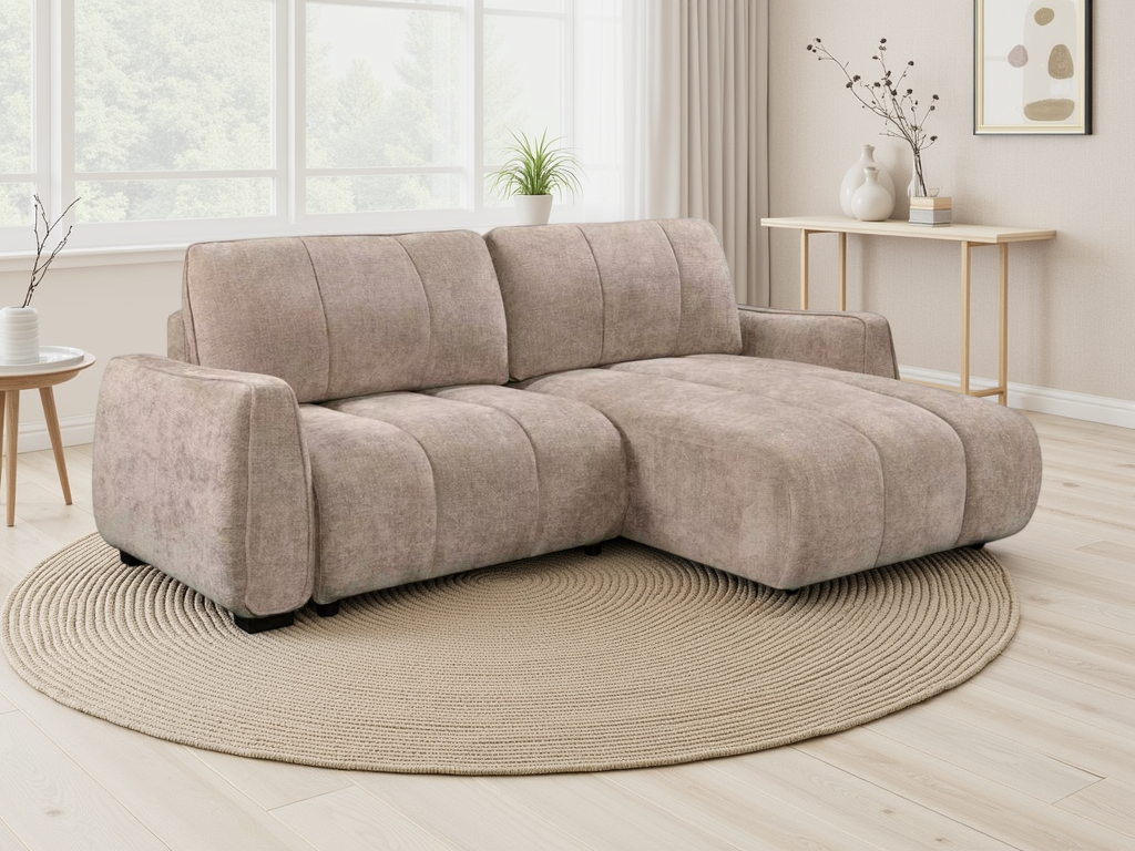 A light beige sectional sofa with a chaise lounge, upholstered in a textured bouclé fabric, 