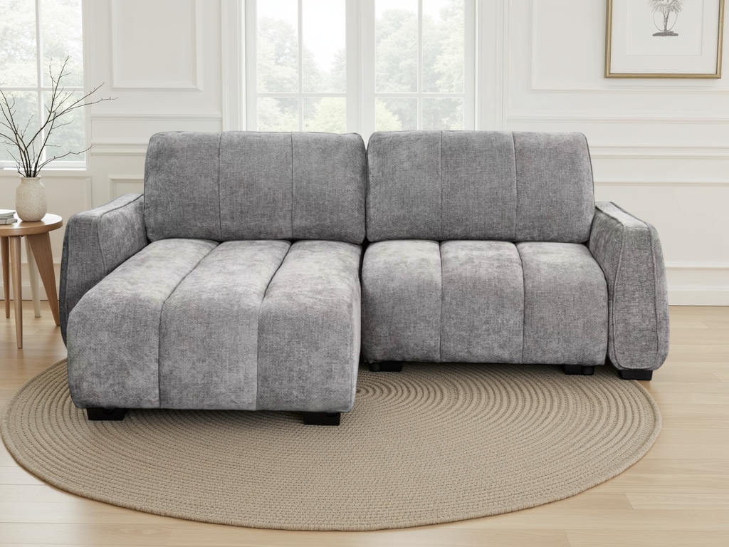 A modern grey fabric sectional sofa with a chaise lounge.