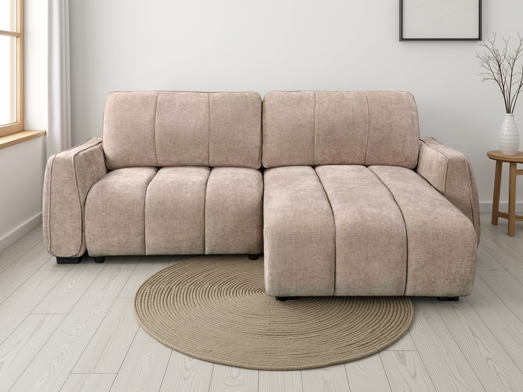 A modern beige sectional sofa with a right-facing chaise lounge, upholstered in a textured bouclé fabric, set in a bright, minimalist living room.
