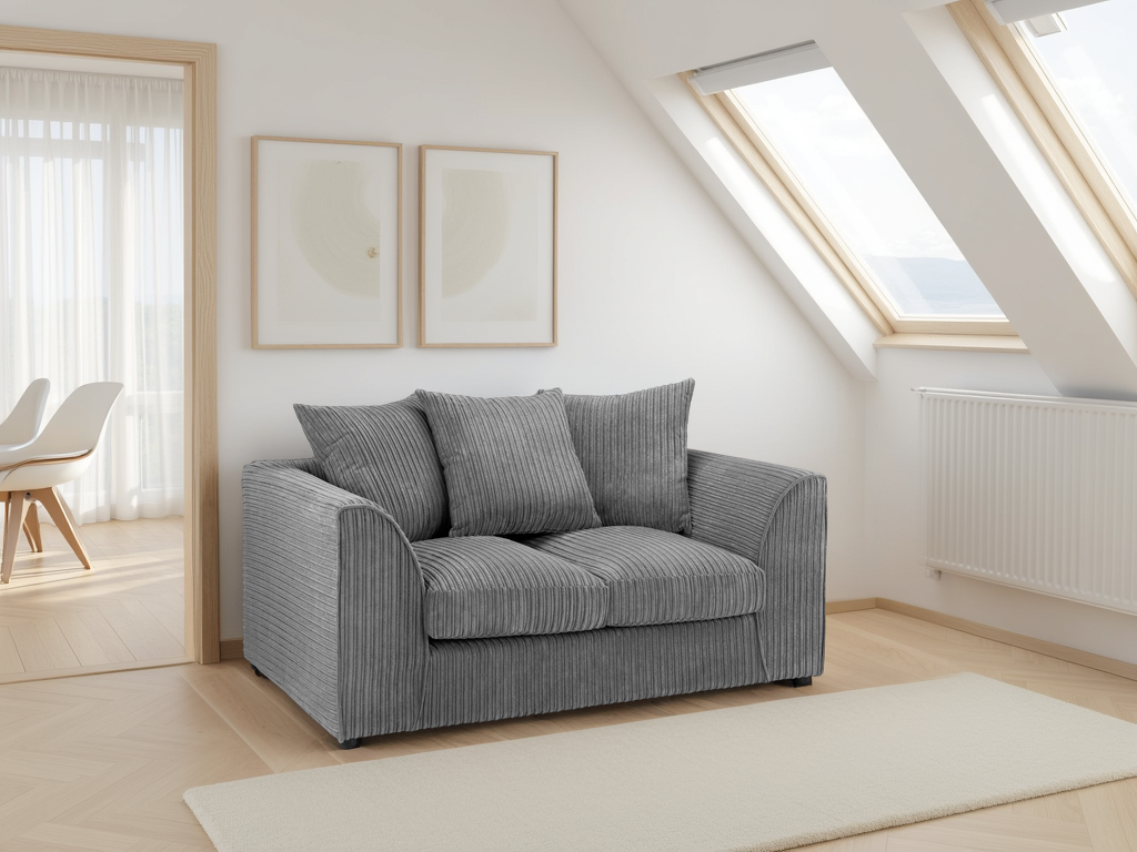 Gray sofa in a bright room with skylights and minimal decor